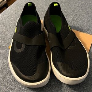 OOFOS Black and White Slip-On Shoes